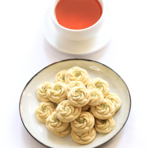 Pistachio Kolompe with a cup of tea